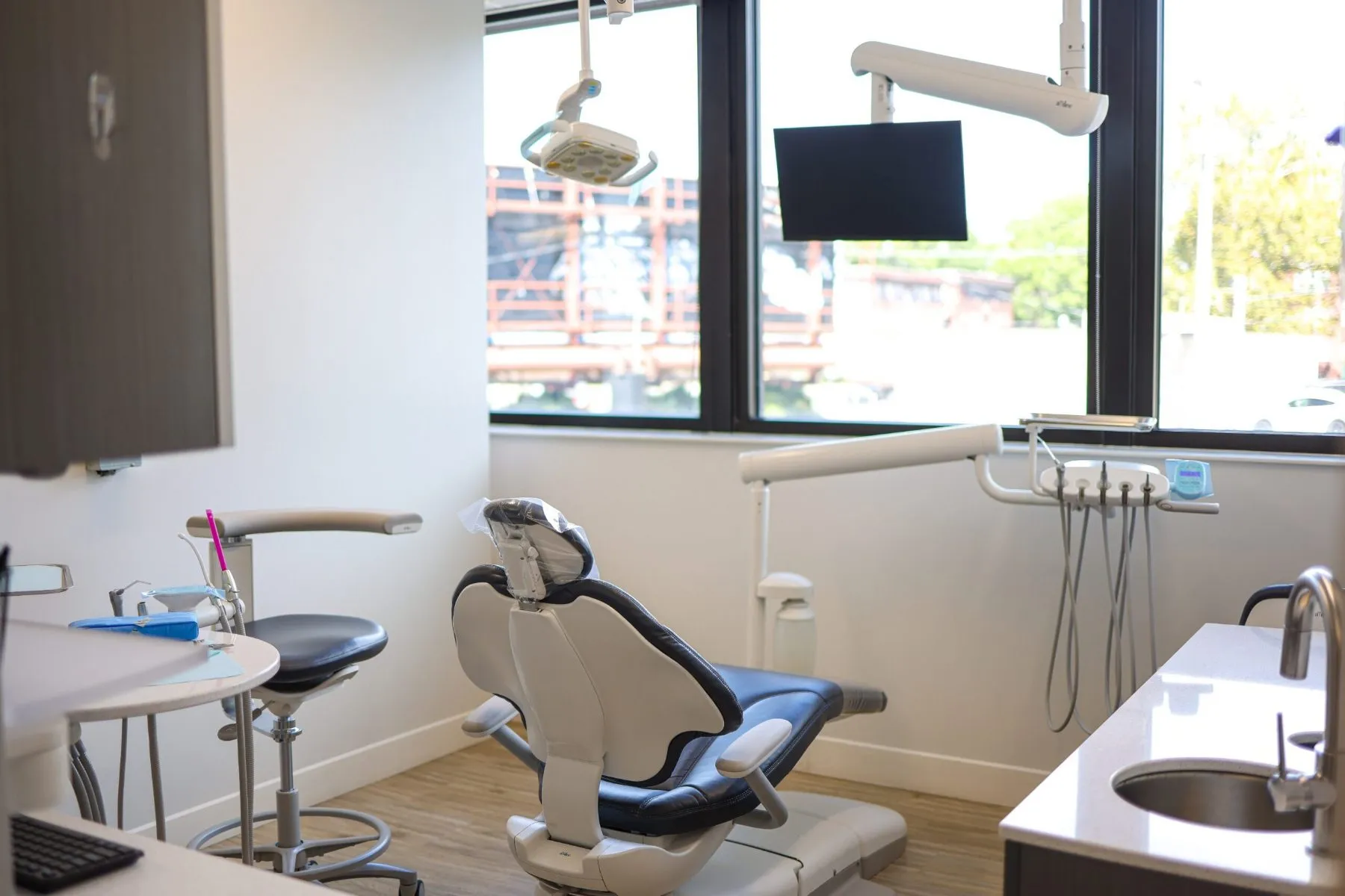 A bright treatment room with large windows at our Westport dental office