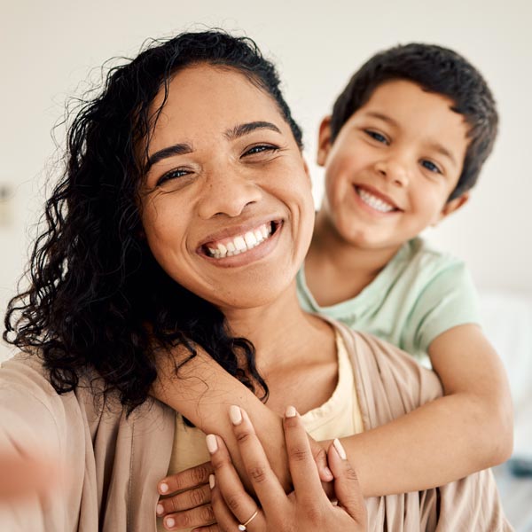 mother and son smiling